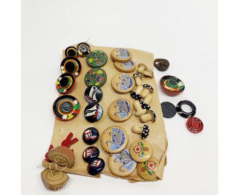 A collection of vintage wooden and other buttons.
