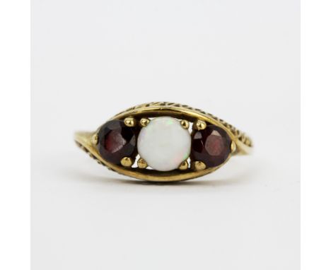A hallmarked 9ct yellow gold ruby and opal set ring, (P.5).