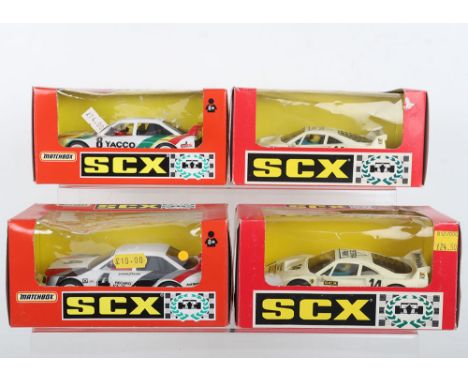 Four boxed SCX slot cars, two Spanish edition ref 83550 Ferrari F-40 Tetra, two Matchbox SCX cars ref 83620.20 Audi 90 IMSA a