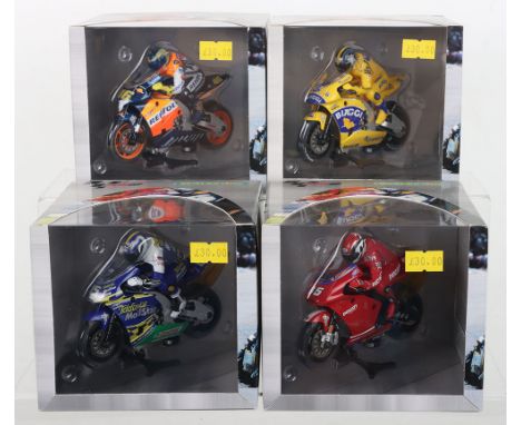 Four boxed Scalextric Moto GP slot motorbikes, C6000 Honda Valentino Rossi, C6001 Honda Max Biaggi, C6003 Honda Sete Gibernau