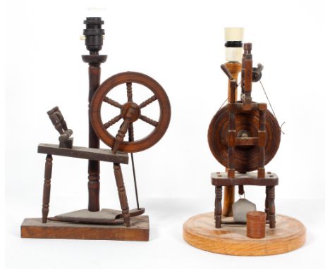 A 20th century novelty spinning wheel table lamp, 35cm high; and another similar