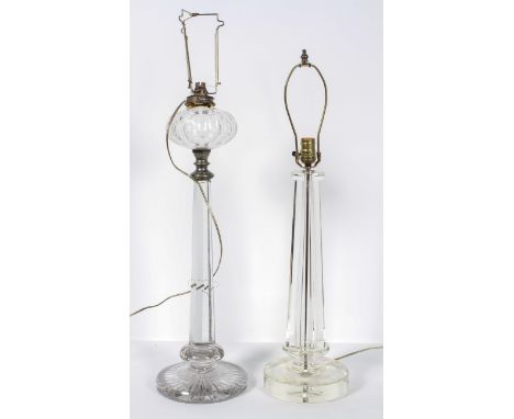 A large glass oil lamp, the ovoid reservoir on a tapering octagonal column and circular star cut base, converted to electrici