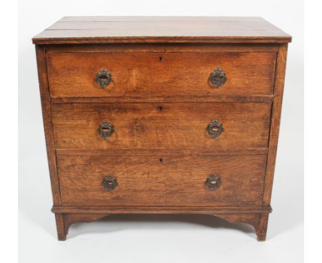 A 19th century oak three drawer chest, with three long graduated drawers, on ogee bracket feet with later brass ring and shie