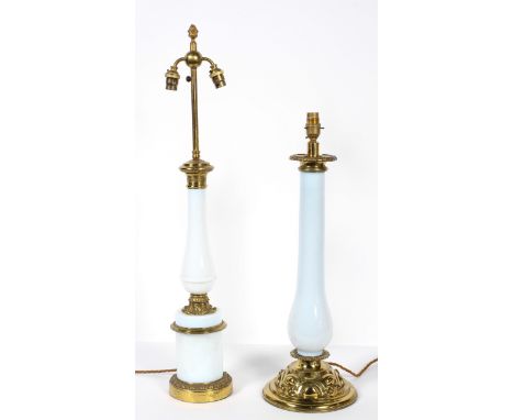A gilt metal and milk glass lamp base, of baluster form, on a cylindrical base, the mounts with stiff leaf decoration, total 