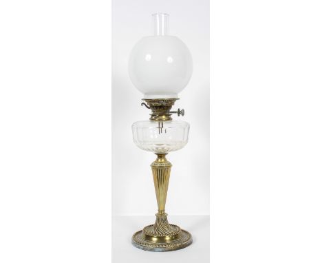 A Victorian brass and glass oil lamp, with clear chimney and opaque globe shade, the burner marked for 'C R Dibben/170 Sloane