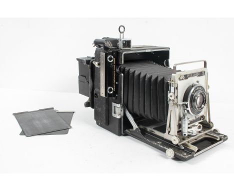 A Graflex 4" x 5" large format still picture camera, type C-6, with Kalart synchronizer range finder, eight plates and case