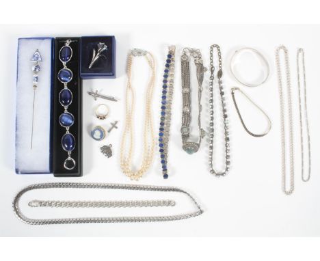 A collection of jewellery to include: A silver 925 heavy curb bracelet; Two silver 925 chains; A silver half engraved bangle;