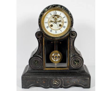 A late 19th century slate and marble mantle clock, the drum shaped top with enamel dial and brass mechanism within glazed hin