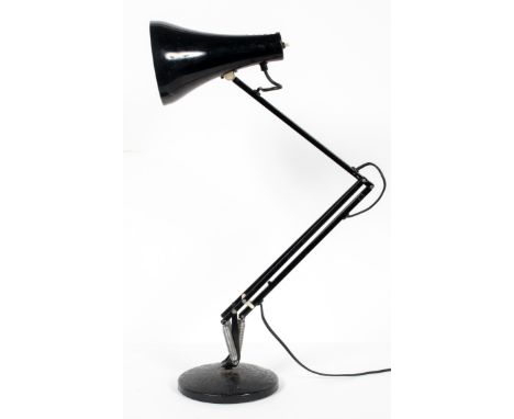 An angelpoise lamp, black painted, on a circular foot