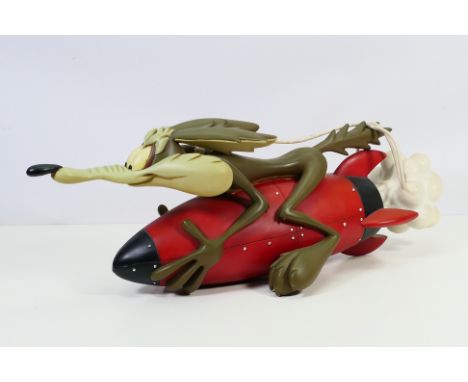 Warner Bros - A rare large resin sculpture/statue of Wile E Coyote from Road Runner, riding a red rocket, attributed to desig