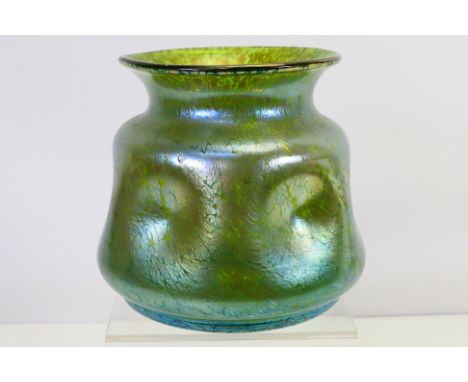 An iridescent green glass vase in the manner of Loetz, approximately 15 cm (h). [W]Condition Report: Appears in good conditio