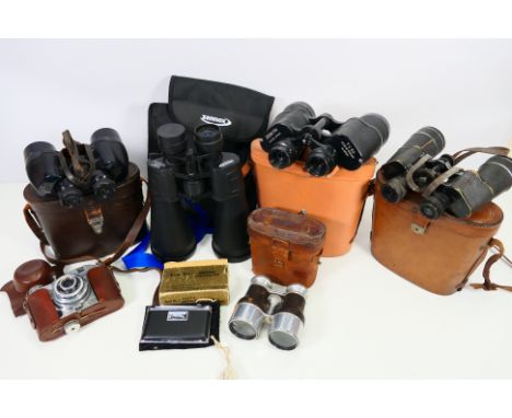 A quantity of cased binoculars to include Zennox, C P Goerz and other and a camera. [W]