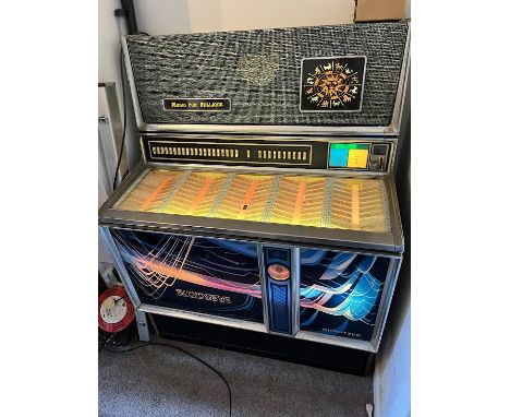 A vintage Wurlitzer jukebox, model Zodiac, circa 1970's, approximately 132 cm x 101 cm x 64 cm. [W]NOTE: ITEM IS LOCATED IN T