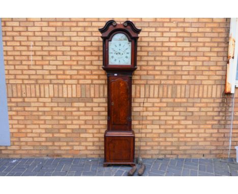 A late 18th century 8-day longcase clock in an oak and cross-banded mahogany case, the painted arched dial signed John Winsta