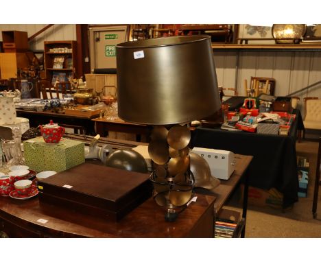 A decorative metal ware disc lamp and shade 