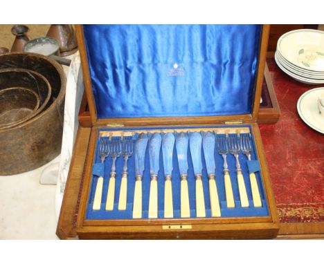 A canteen of Sheffield plate cutlery; together with a canteen of Mappin &amp; Webb fish knives and forks 