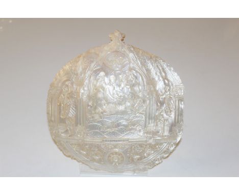 A carved mother of pearl shell decorated with Christening scene, inscribed Jerusalem