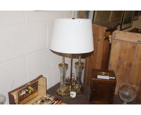 A brass and glass Waterford table lamp and shade