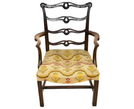 A George III mahogany ladder backed armchairin the manner of Thomas Chippendale, carved serpentine pierced ladder, with shape