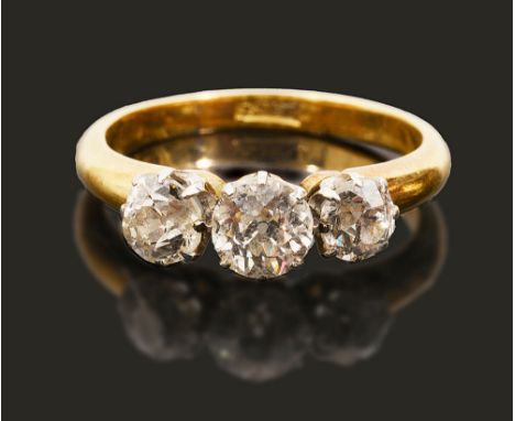 A Victorian diamond three stone ring,the three graduated old brilliant-cut diamonds in a yellow gold coronet setting, the sha