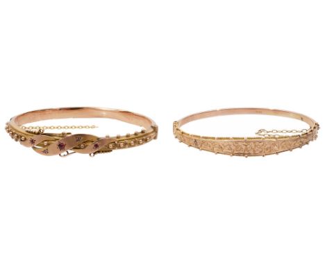A Victorian 9ct gold ruby and diamond hinged bangle hallmarked, the hollow bangle inset with diamonds and rubies flanked by r