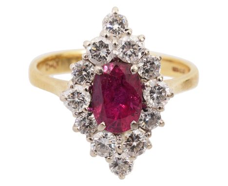 A ruby and diamond set ring,  the oval mixed cut ruby within a navette-shaped surround of twelve brilliant-cut diamonds to th