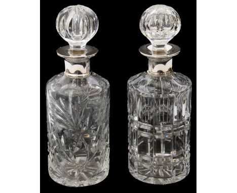 Two modern silver topped crystal decanters and stoppersfirst London, date letter rubbed by Roberts &amp; Dore Ltd,  second ma