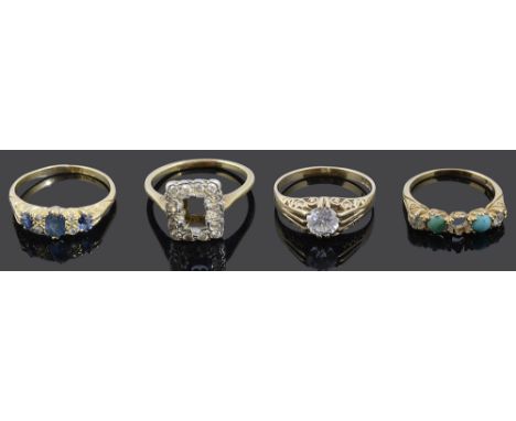 Four various gem set rings comprising three stone sapphire ring having diamond point detail and 18ct gold scroll mount, 18ct 