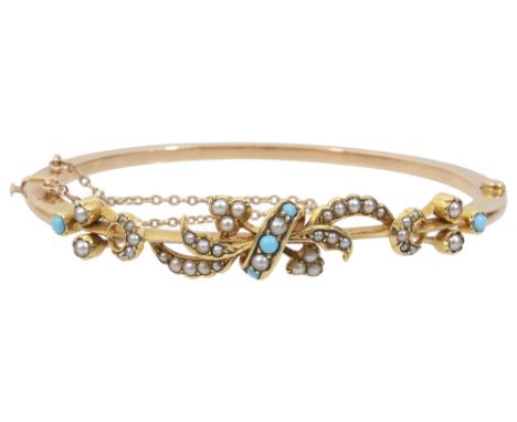 An attractive Victorian turquoise and seed pearl hinged banglethe bangle of stylised foliate scroll design with crescent deta