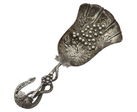 A Victorian silver caddy spoon Birmingham, 1869, with a shovel shaped bowl embossed with grapes and a fruiting vine scroll ha