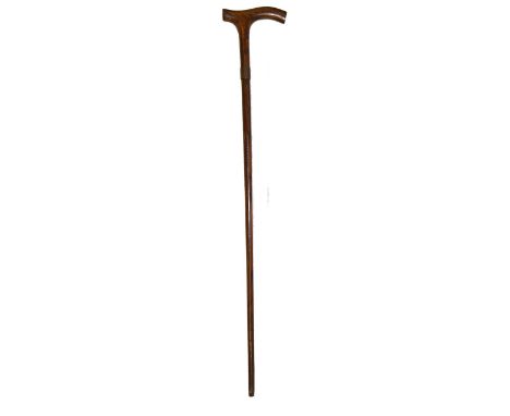 An early 20th walking stick, made from timber removed from the H.M.S. Britannia, mounted with a brass collar detailing proven