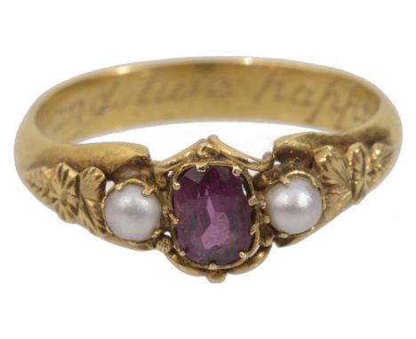 An early Victorian ruby and pearl three stone ringhaving central oval ruby between two small pearls the yellow metal mount wi