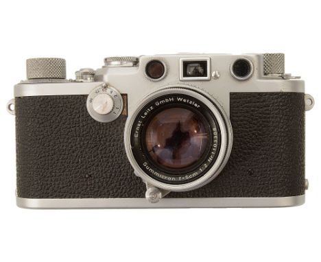 A Leica IIIF camera, No. 663905, 1953with Leitz Wetzlar Summicron f=5cm 1:2 Nr.1103308,  outer leather case, accompanied by t