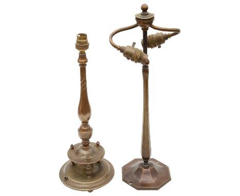 An Edwardian anodised brass table lamp and another first having twin scroll fitting on hexagonal baluster stem and spreading 