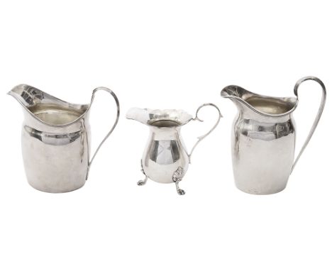 A George III silver cream jug and two other cream jugs in Georgian stylefirst London, 1795 maker mark S?H. probably Solomon H