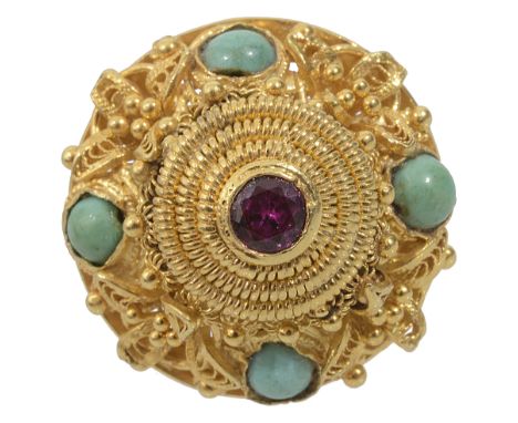 An Eastern ruby and turquoise set coil ringset with a central single ruby (not tested) and four turquoise, the yellow metal m