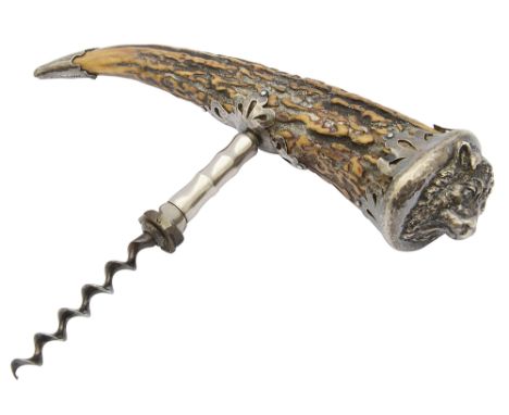 A late 19th century American silver mounted antler corkscrewmounts of pierced and hammered design, one taking the form of a b