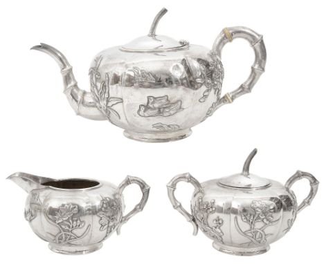 An early 20th century Chinese export silver three piece tea servicemarked for Kwan Wo, Canton or Hong Kong c.1900comprising t