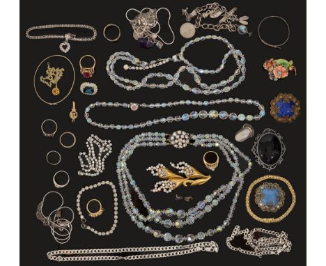 A small collection of gold and silver jewellery and various costume jewellerycomprising a 9ct gold bangle and several charms,