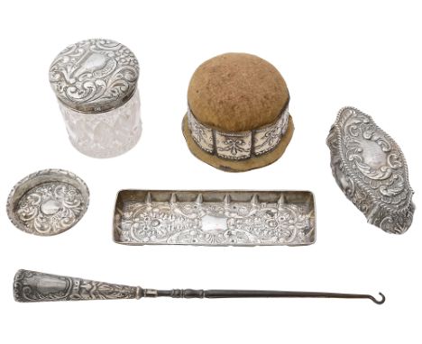 A late Victorian silver trinket pot, and Edwardian silver mounted velvet pincushion, a pin tray and other silver itemsfirst C