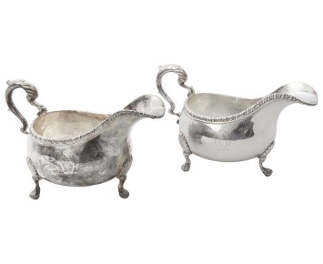 A pair of early George III silver sauce boatsmakers mark only W.T? probably London, William Turtonoval form with gadroon bord