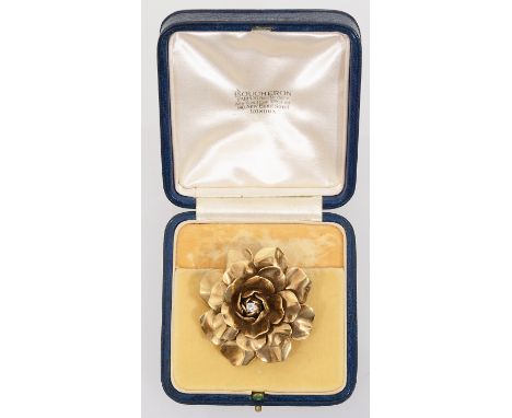 A large diamond-set floral clip brooch by Boucheron, circa 1940the tiered yellow gold petals centrally-set with a brilliant-c