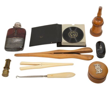 A 19th century treen boxwood glove powderer and other itemstogether with a pair of ivory glove stretchers, another larger pai