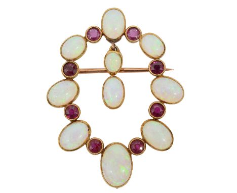 An Edwardian opal and ruby brooch, the openwork oval alternately set with graduated oval opal cabochons and circular-cut rubi