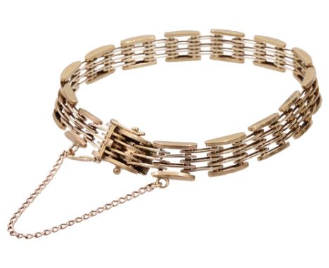 A 9ct gold stylised gate braceletmarked on the clasp .375, with alternating four and three gate with safety chainweight appro