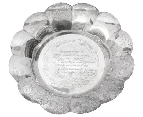 A George V silver dishLondon, 1930 by the Goldsmiths &amp; Silversmiths Co.of circular plain form with flared petal shaped ri