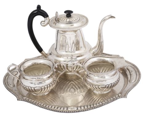 An Indian three piece silver tea service and a traystamped St Silvercomprising teapot with ebony scroll handle and finial, tw