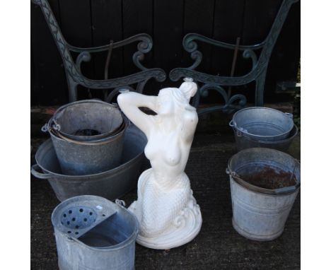 A pair of bench ends, together with a collection of galvanized items and a figural table base, 59cm high