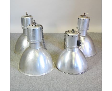 A set of three industrial light fittings, 56cm diameter, together with another smaller (4)