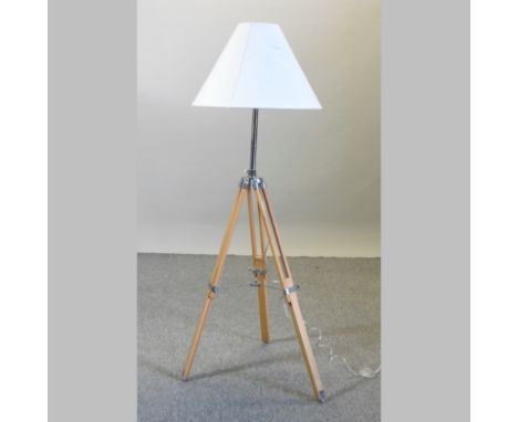 A modern standard lamp, on a tripod stand